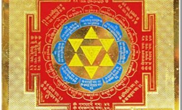 Image of the Baglamukhi Maha Yantra, a sacred geometric diagram adorned with intricate Sanskrit symbols and patterns, representing the divine energy of the Hindu goddess Baglamukhi. The yantra is typically depicted on a metal plate or paper, serving as a focal point for worship and spiritual empowerment